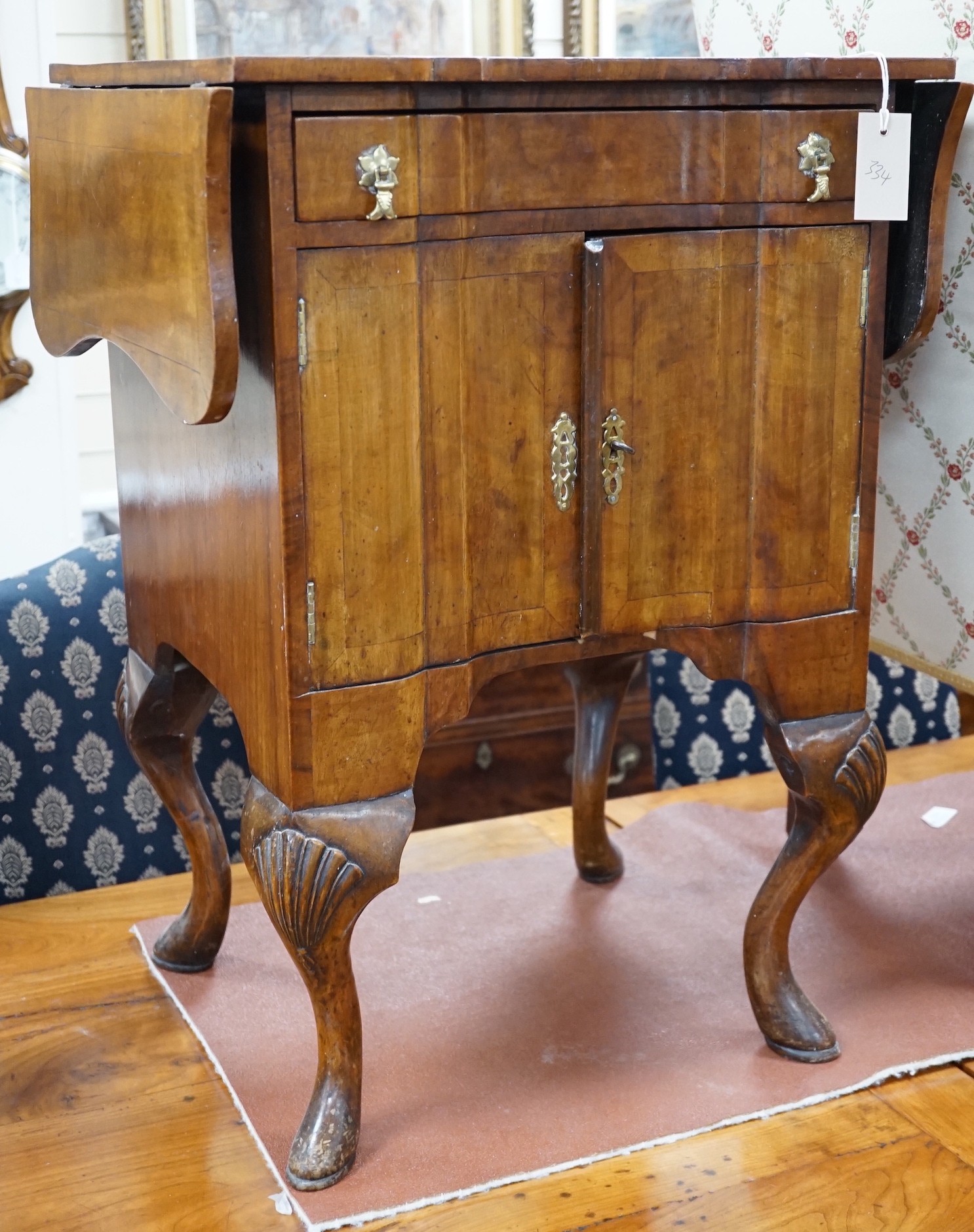 A 1930's walnut bedside cabinet, width 55cm *Please note the sale commences at 9am.